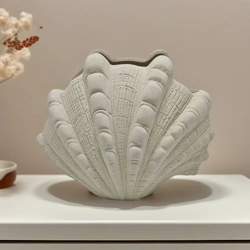 White ridged ceramic clam shell vase with textured matte finish for living room decorbites ceramic clam use