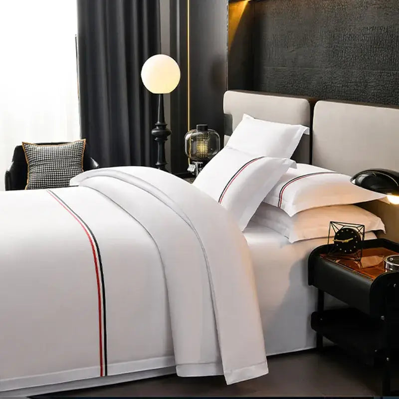 White satin bedding set with red and black striped trim from decorbites cozy solid color collection for bedroom decor
