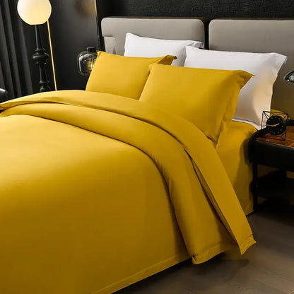 Vibrant mustard-yellow satin bedding set with matching duvet and pillows for decorbites cozy solid color bedroom decor