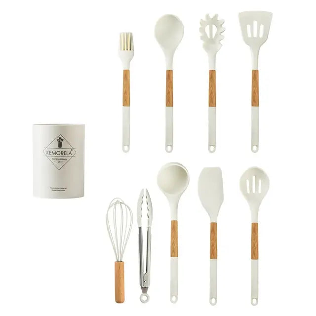 White silicone kitchen cookware set with wooden handles including spatulas spoons brush and tongs with holder