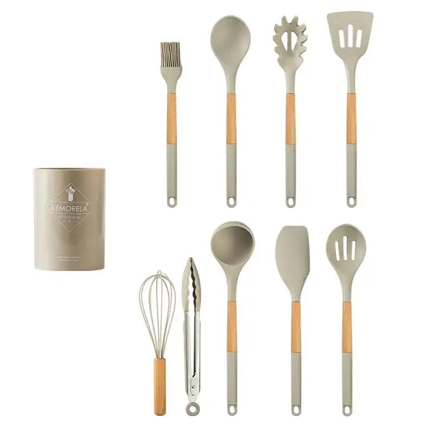 Set of ten white silicone kitchen cookware utensils with wooden handles and matching cylindrical storage container