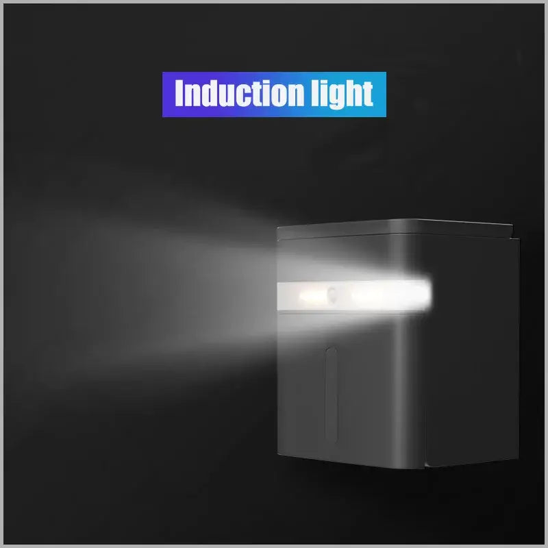 White smart sensor toilet paper holder with black rectangular induction light emitting bright white beam for bathroom use