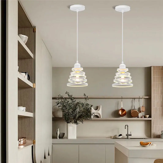 Two white pendant lights with spiral iron cage ring shades hang from the ceiling for kitchen and living room decorbites iron cage design