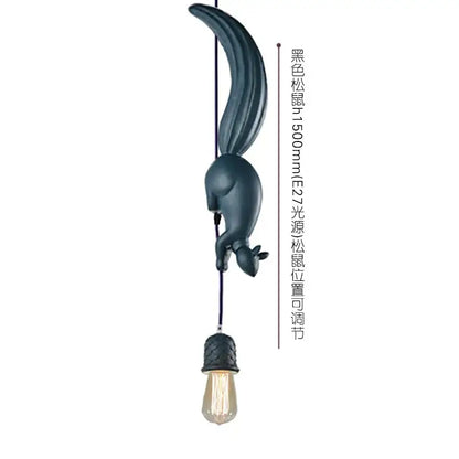 Dark blue matte squirrel-shaped pendant light with textured black cord and exposed edison bulb decorative focal point