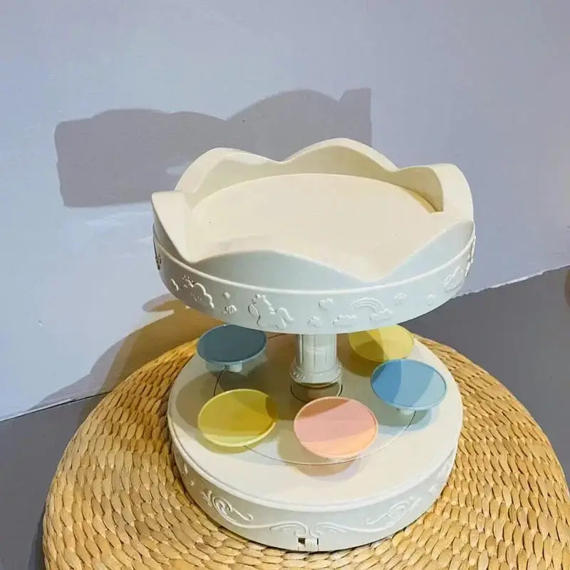 White two tiered rotating dessert table with pastel floral top and cloud patterns for sushi machine dining room use