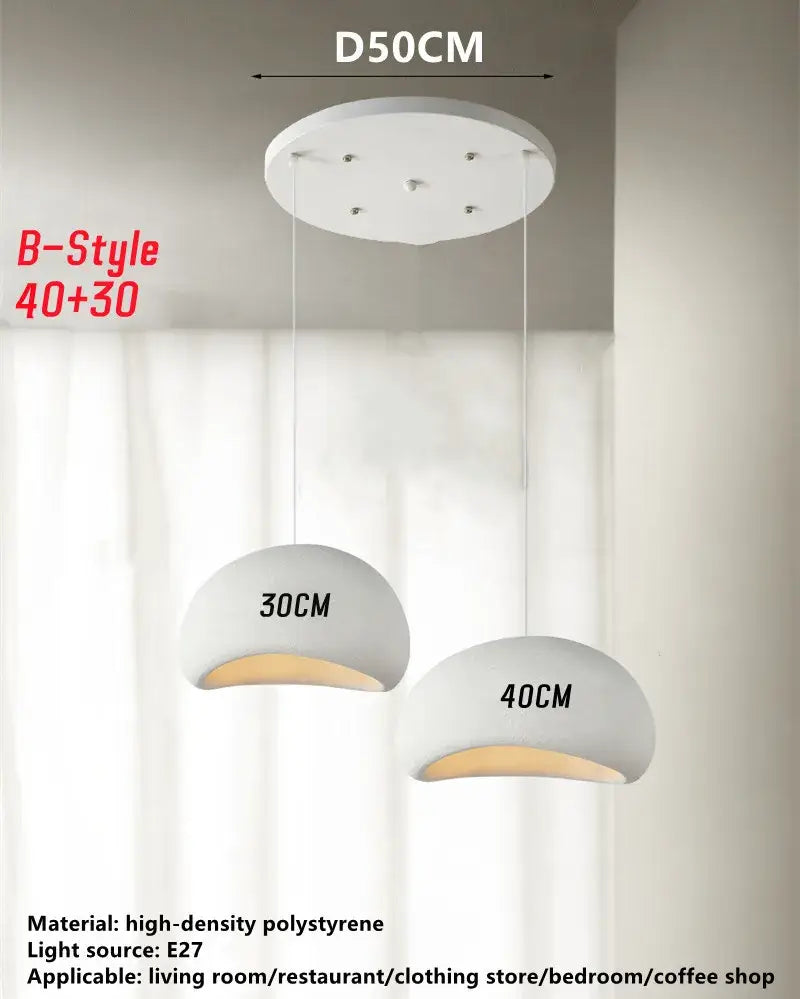 White dome-shaped handmade wabi sabi pendant lamp made of high-density polystyrene with warm e27 bulb glow for dining room decorbites