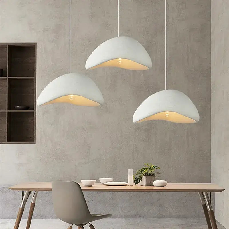 Three modern white ceramic pendant lamps with curved shell-like shades for dining room decorbites handmade wabi sabi