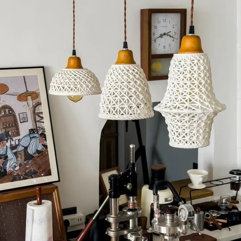 Three white woven rope ceramic led pendant lights with wooden tops hang from braided cords for kitchen decorbites ceramic led pendant