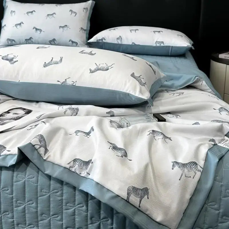 White and light blue zebra-patterned quilt set with quilted border made of decorbites cool silk summer fabric