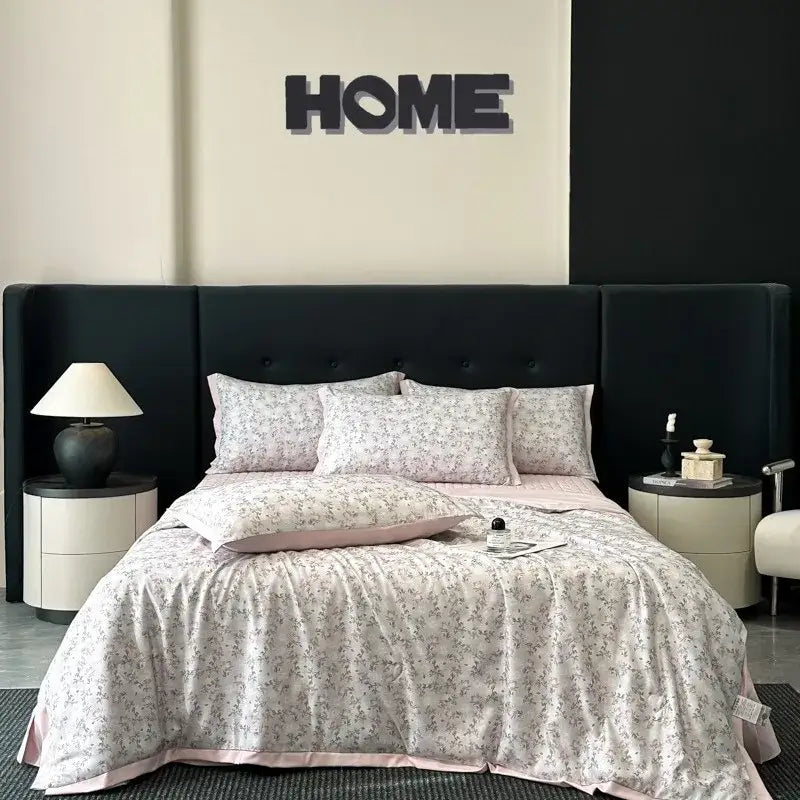 Pink floral quilt set with subtle pattern and satin trim from decorbites cool silk summer bedding collection
