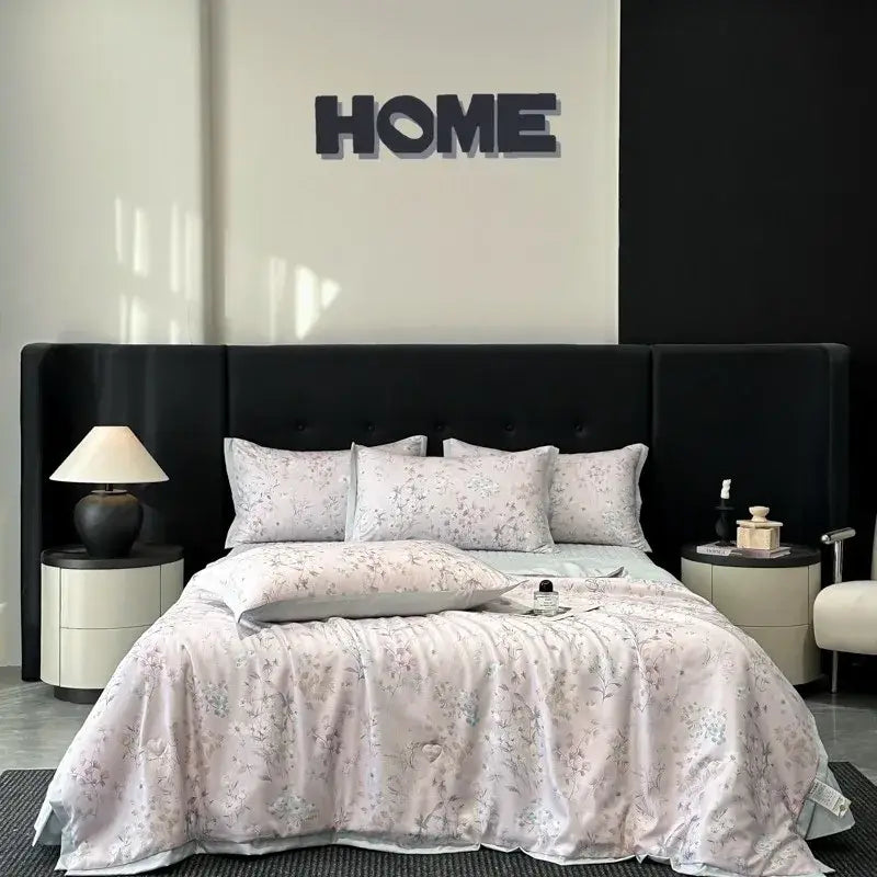 A soft light pink floral-patterned satin quilt set with delicate gray blossoms from decorbites cool silk summer bedding