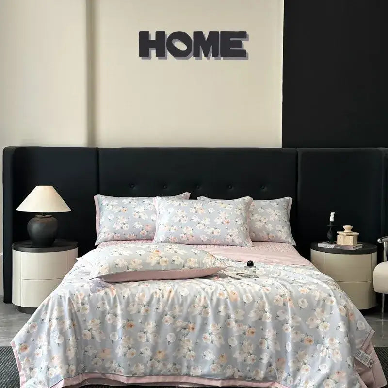 A soft light blue satin duvet cover with white and blush florals and pink trim from decorbites cool silk summer quilt set