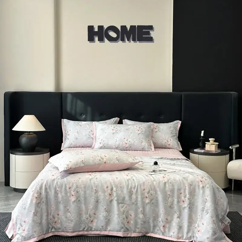 A soft light gray cool silk summer quilt set with pink floral embroidery and matching piping by decorbites