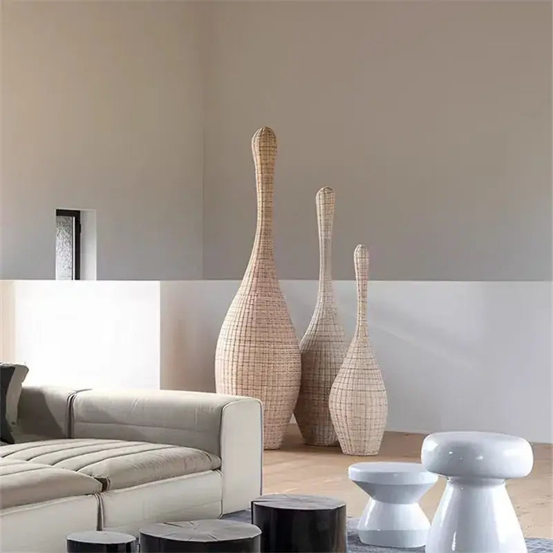 Three tall slender rattan vases in natural beige color enhancing decorbites bamboo floor lamp modern living room decor