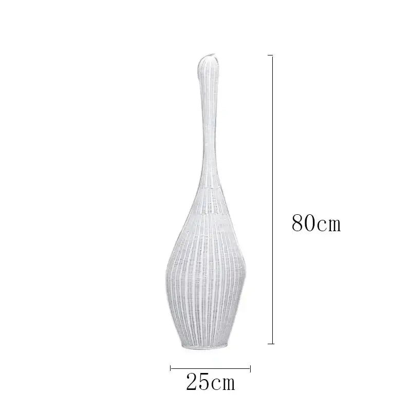 A tall slender white woven vase with flared top and tapered base complements bamboo floor lamp decorbites floor lamp