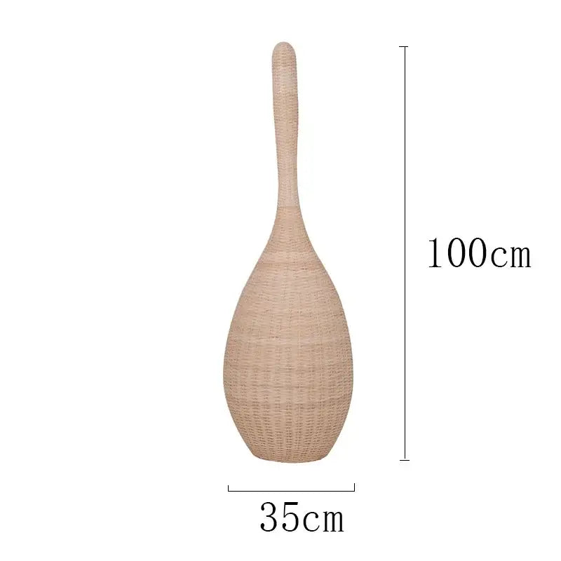 A tall beige woven rattan vase paired with a wicker dark brown bamboo floor lamp for warm living room decorbites bamboo floor lamp