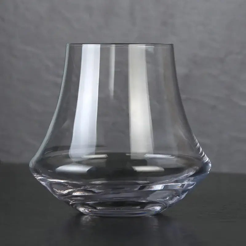 Clear glass crystal whiskey glass tumbler with flared rim and faceted base for dining room spirits by decorbites