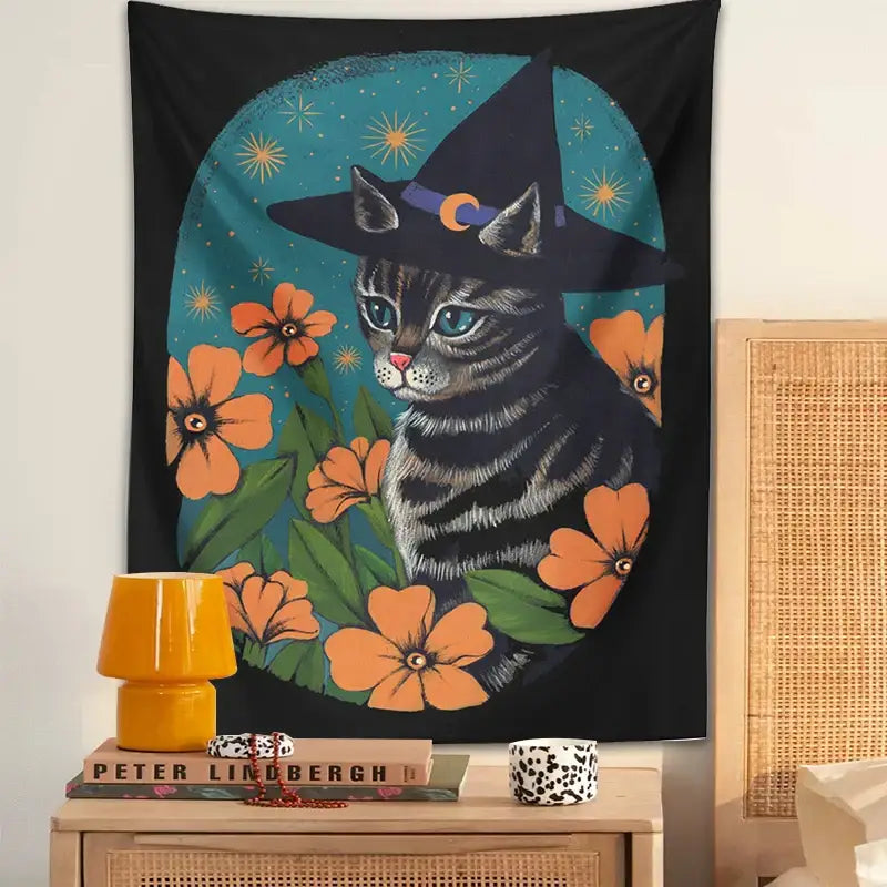 Black tapestry wall hanging featuring a gray tabby cat with a witch hat and orange flowers for decorbites cat tapestry wall decor