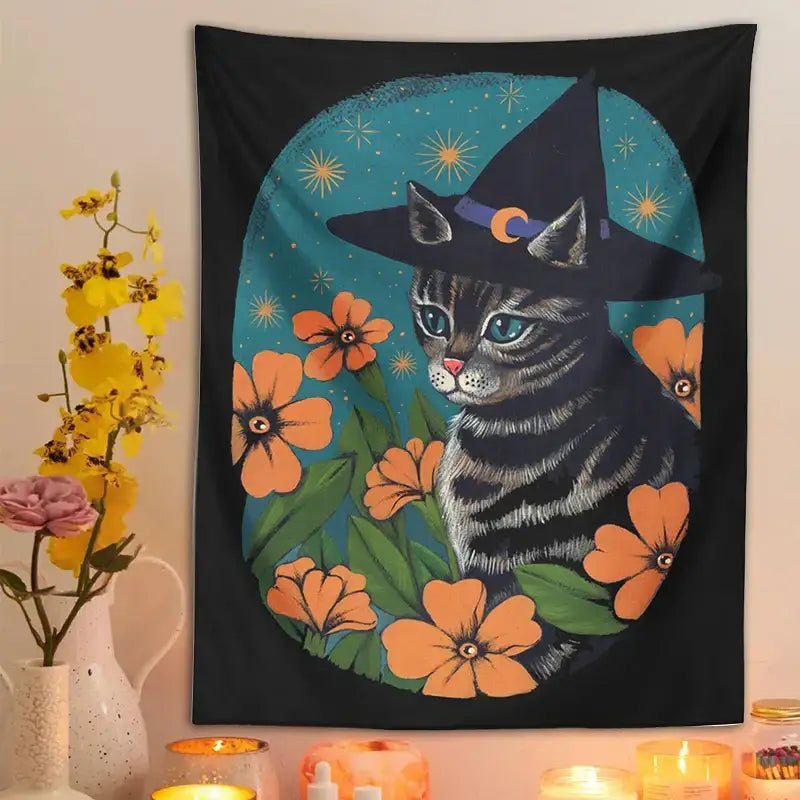 Black tapestry wall hanging featuring a gray tabby cat with a witch hat and orange flowers for decorbites cat tapestry decor