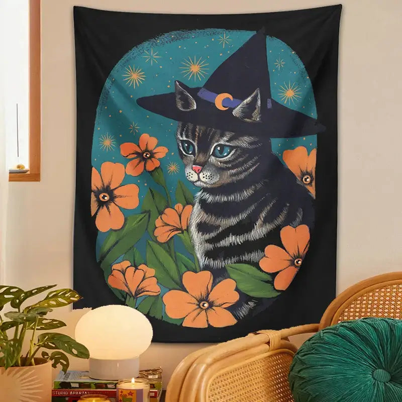 Black tapestry wall hanging featuring a gray tabby cat wearing a witch hat with orange flowers for decorbites cat tapestry wall decor