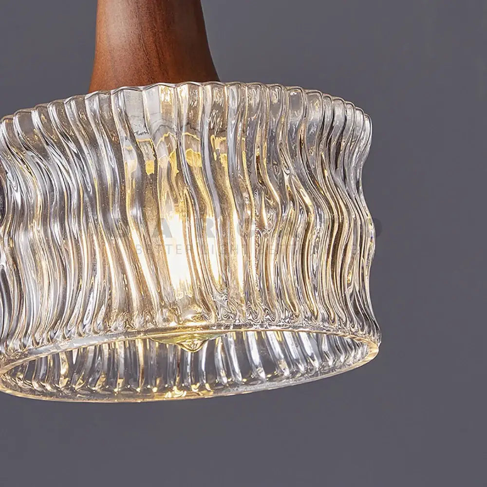 Clear wavy textured glass pendant light with warm wooden stem compatible with led bulb for dining room lighting