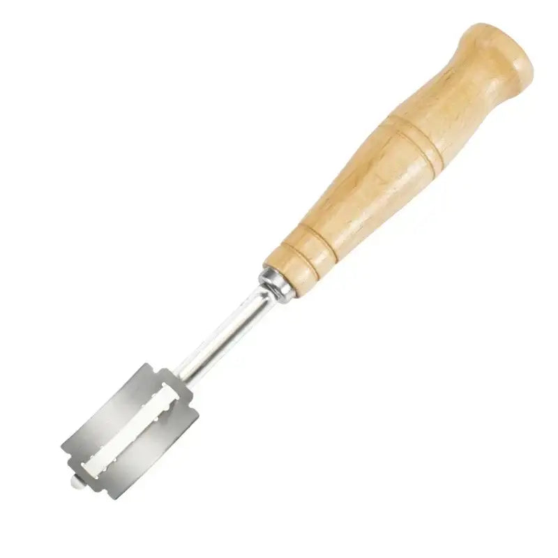 Wooden bread lame cutter with light wood handle and sharp serrated metallic blade with leather cover for baking use
