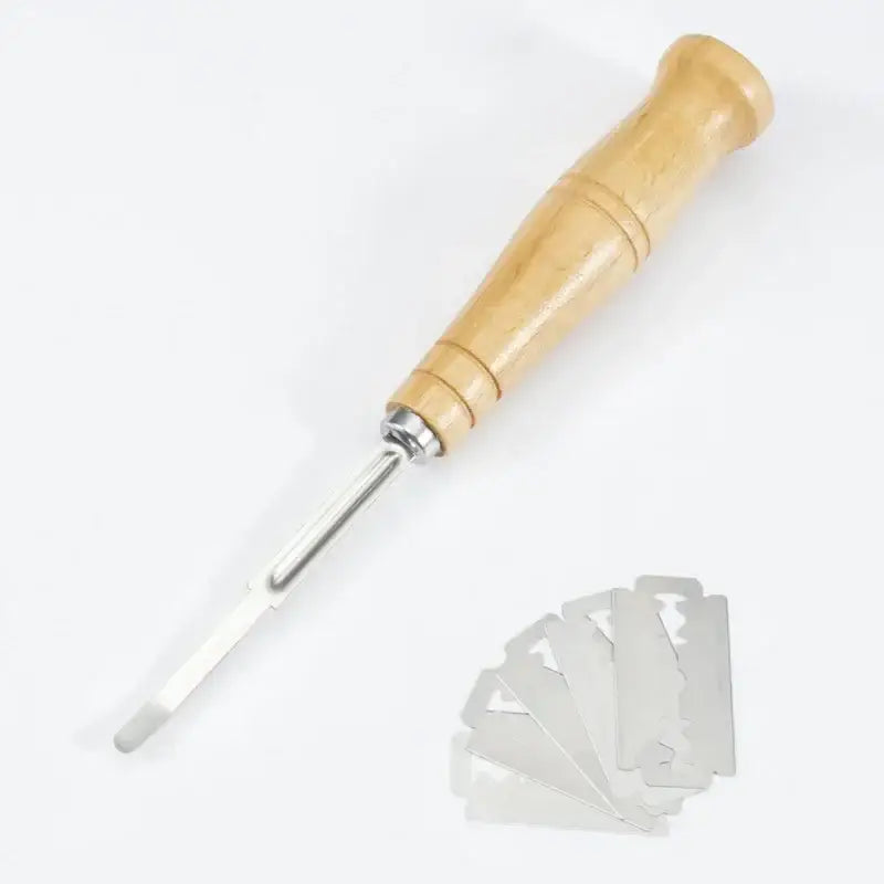 Wooden bread lame cutter with leather cover featuring wooden handle and silver curved metal tip with stainless steel blades