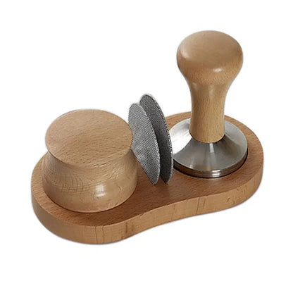 Wooden espresso distributor tamper with polished metal base and ergonomic handle alongside two stainless steel tampers on tray