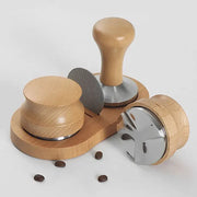 Wooden espresso distributor tamper set with stainless steel tampers and matching wooden base for kitchen use