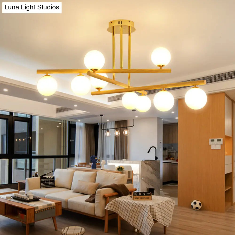 Lámpara de araña esférica de madera con pantalla de cristal opalino para iluminación minimalista de dormitorio