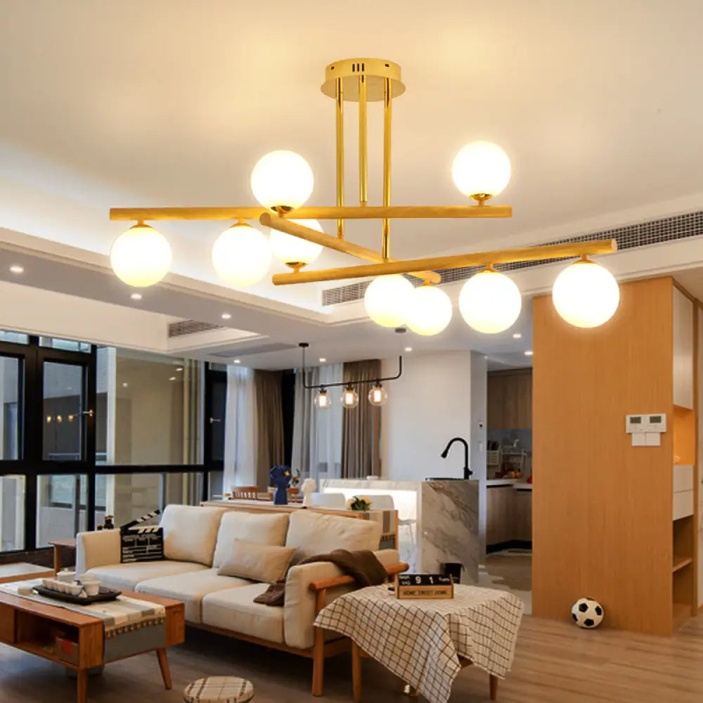 Lámpara de araña esférica de madera con pantalla de cristal opalino para iluminación minimalista de dormitorio