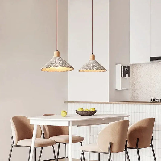 Two woven beige pendant lights with wood accents hanging, perfect as decorbites designer pendant light for bedroom