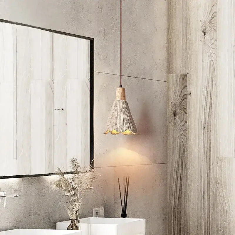 Beige woven pendant light with wooden top and scalloped edge hanging from thin cord decorbites designer pendant light