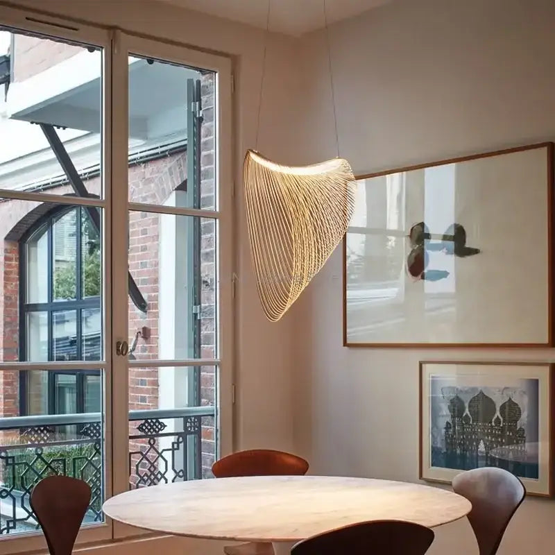 A warm golden woven birch wood led pendant lamp with fan-like metallic threads for dining room decorbites lighting