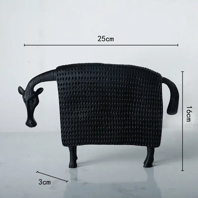 Woven black and white resin sculpture figurine featuring a black textured resin giraffe 25cm long 16cm tall decorbites black cow style