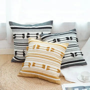 Three decorative woven geometric tassels cushion covers in black white and mustard yellow for living room decorbites decor
