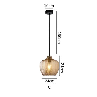Woven gold glass pendant lights with textured amber shade and black metal hardware for kitchen and dining room
