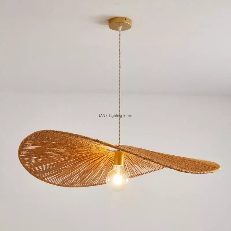 Warm-toned woven hemp rope pendant light with gold metal fixture and exposed bulb for living room decorbites hemp rope