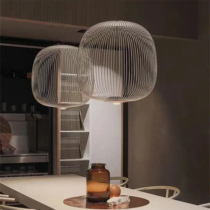 Two spherical pendant lights with woven wireframe design and polished chrome finish for dining room use