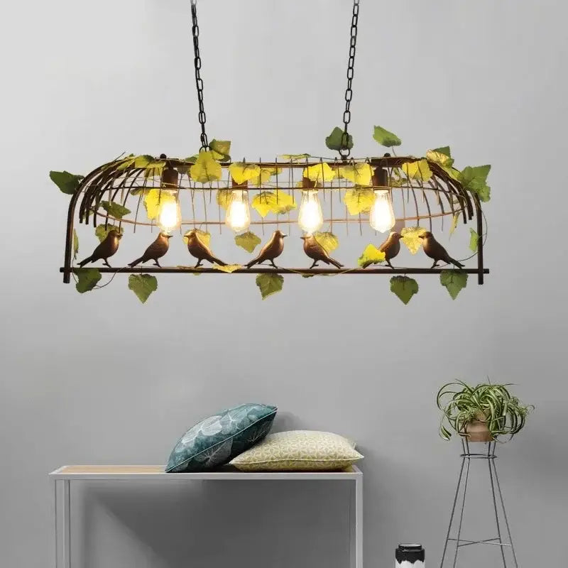 Wrought iron birdcage pendant lights with golden-brown birds green leaves and four exposed bulbs for dining room decorbites birdcage pendant