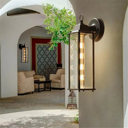 Black wrought iron wall lantern with clear glass panels and vertical led lights decorbites black finish outdoor light