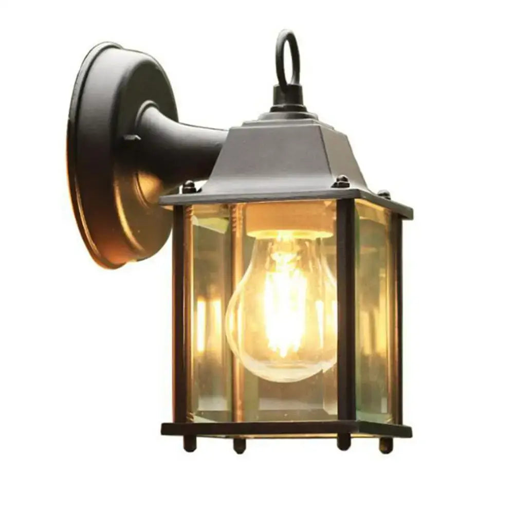 Black finish wrought iron wall lantern with clear glass panels and glowing filament bulb for outdoor porch decorbites black finish