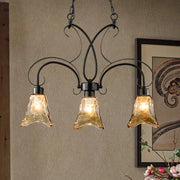 DecorBites black flower island pendant ceiling light with wrought iron frame and three amber textured glass shades