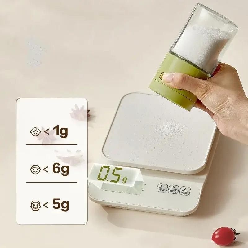 A sleek white digital kitchen scale with a green and clear glass spice dispenser salt grinder on its surface