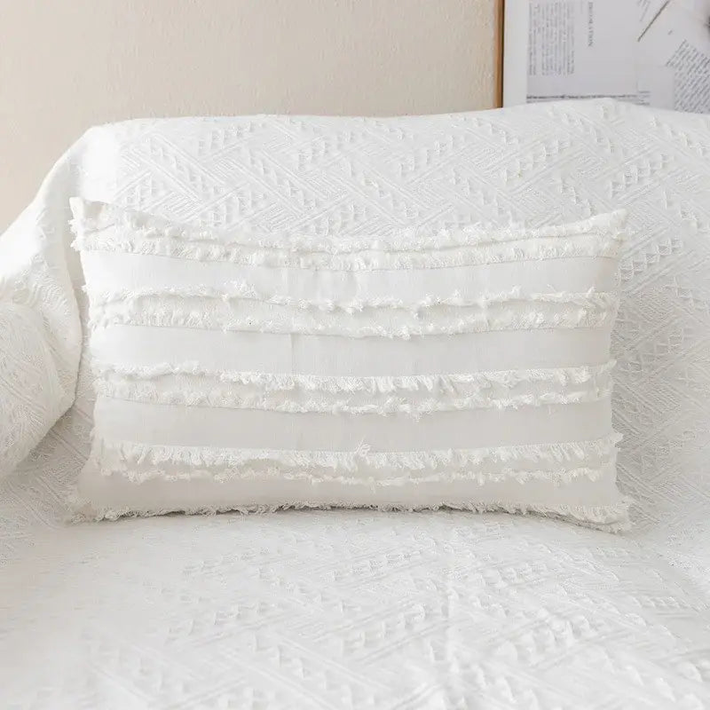 White rectangular pillow cover with yellow and cream daisy floral embroidery and frayed fabric trim decorbites daisy floral decor