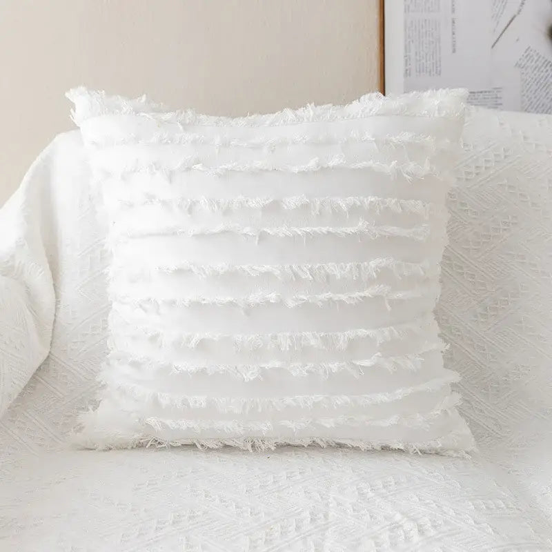 White pillow cover with layered frayed fabric detailing featuring decorbites daisy floral embroidery for living room decor