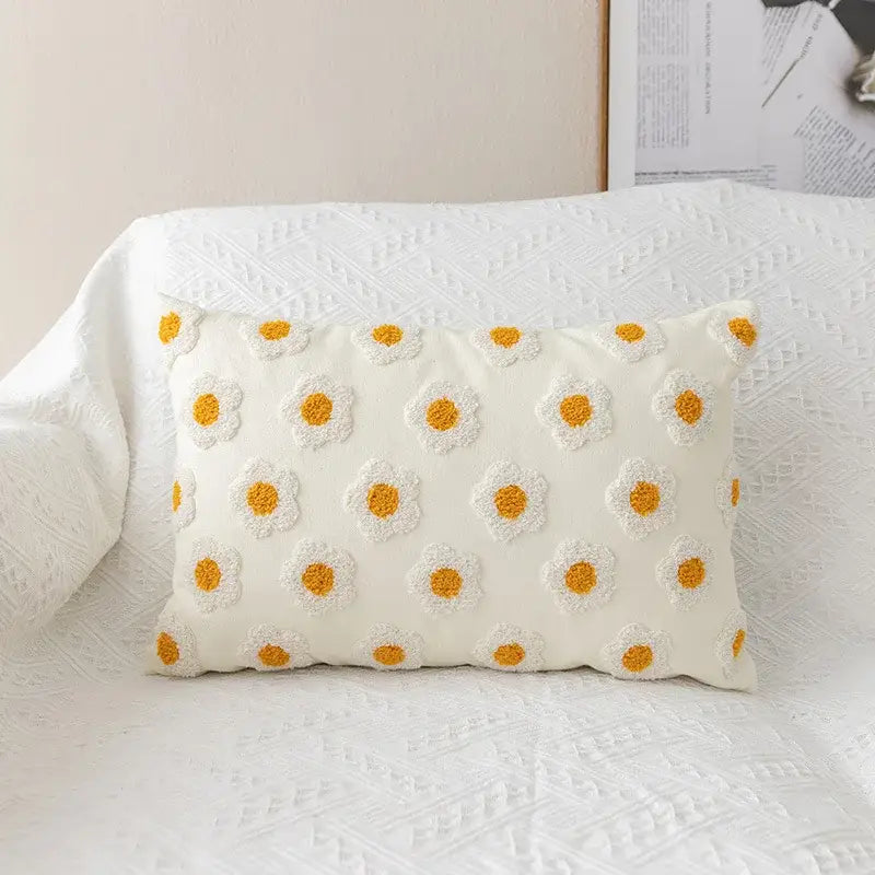 Cream-colored rectangular pillow cover with raised yellow and white daisy floral embroidery decorbites daisy floral design