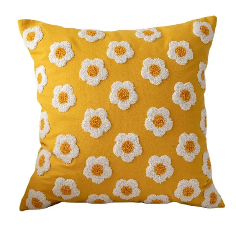 Vibrant yellow pillow cover with raised white and orange daisy floral embroidery by decorbites for living room decor