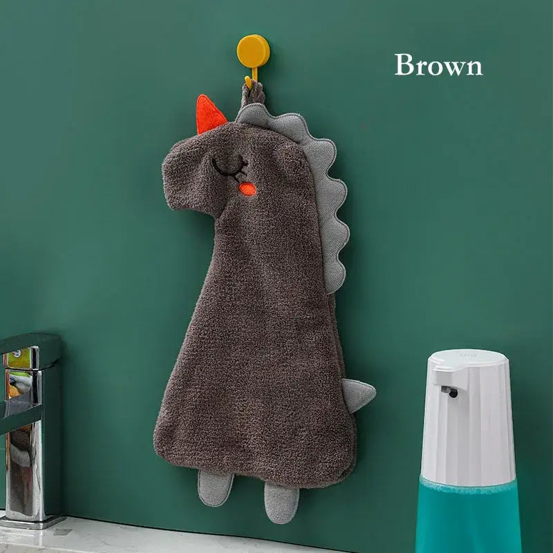 Brown plush dinosaur hand towel with orange horn and gray spines from decorbites cartoon animal kitchen dishcloth