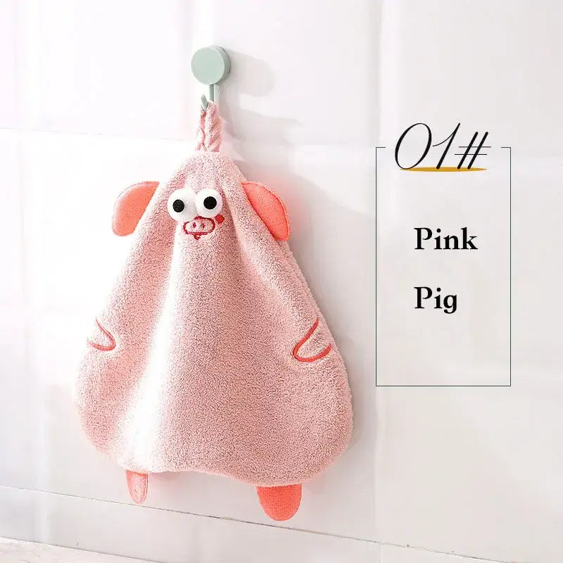 Pink plush pig shaped hand towel with embroidered eyes and orange accents for decorbites cartoon animal hand use